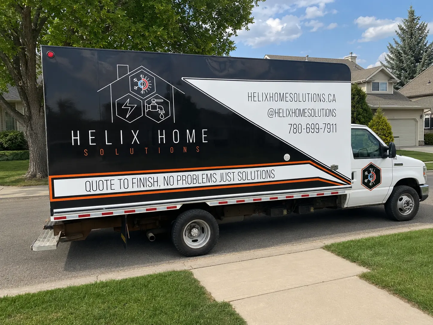 White and black Helix Home Solutions service truck with company logo, website, contact info, and slogan 'Quote to finish, no problems just solutions.'