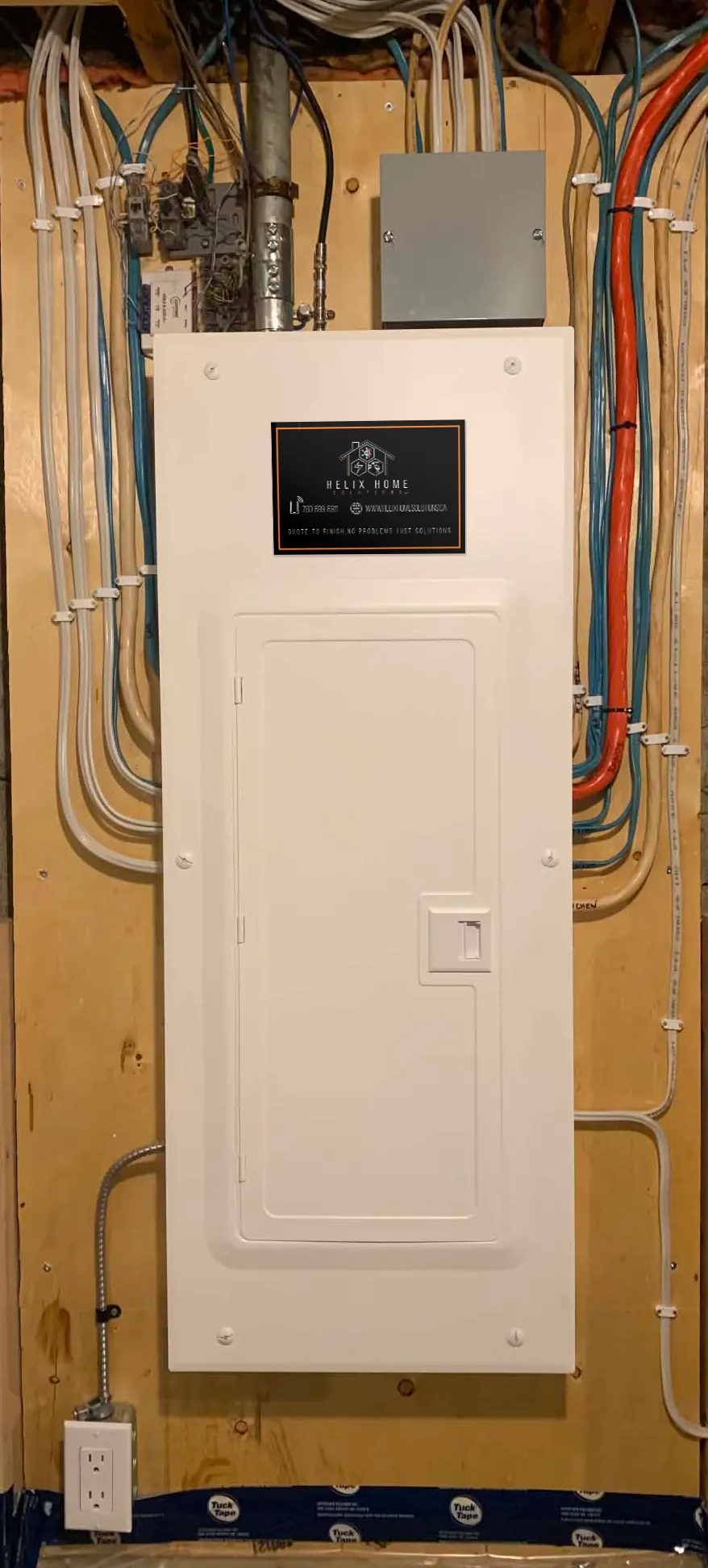 Open electrical breaker panel with two circuit breakers labeled 20 and 30 amps, multiple connected wires, and grounding terminals.