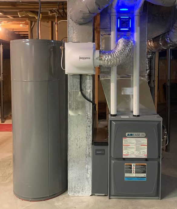 Basement HVAC system with a gray water heater tank, furnace labeled Airease, and ductwork with a GeneralAire air purifier emitting blue light.