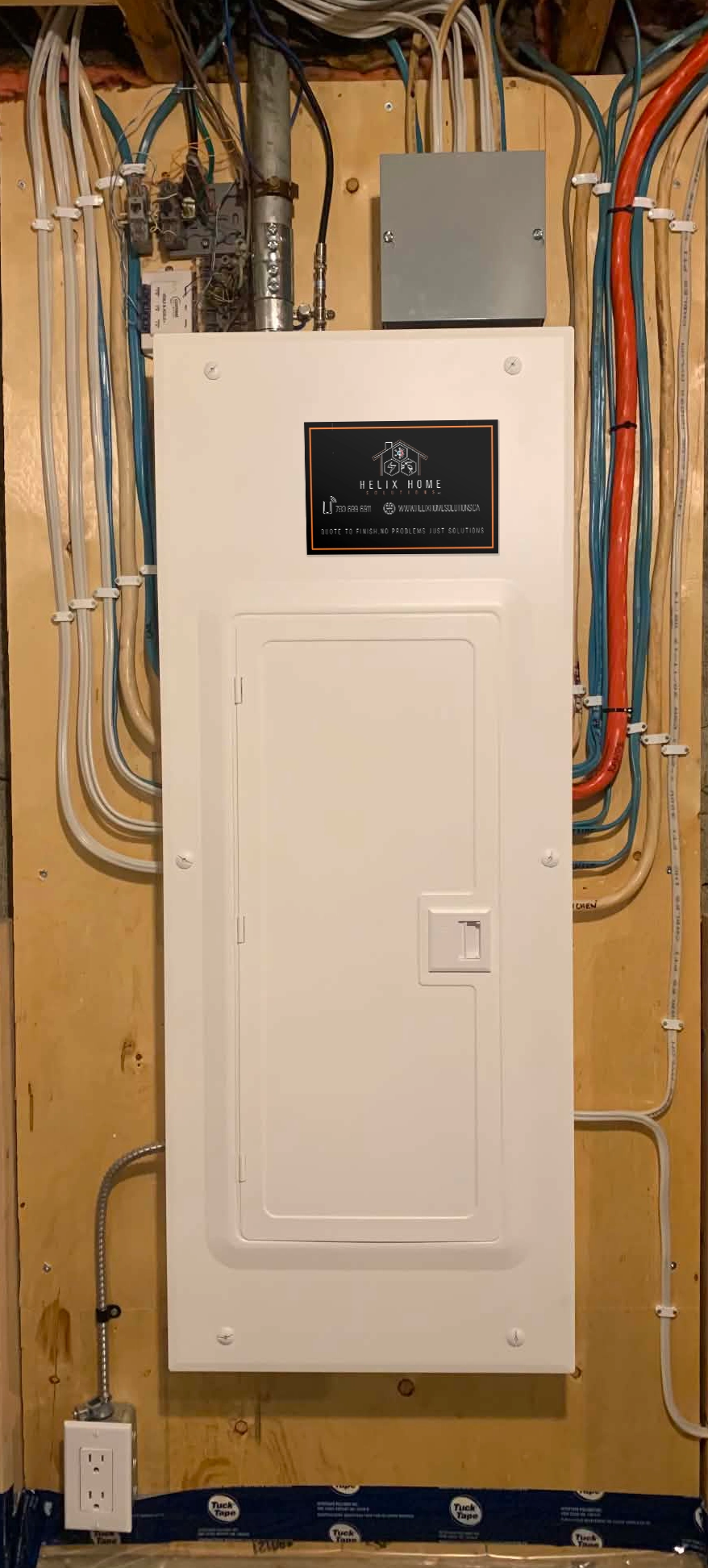 Open electrical breaker panel with two circuit breakers labeled 20 and 30 amps, multiple connected wires, and grounding terminals.